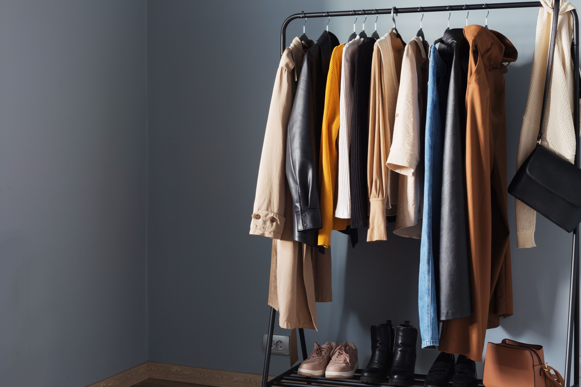 basic women's autumn wardrobe with shoes and handbags on  hanger