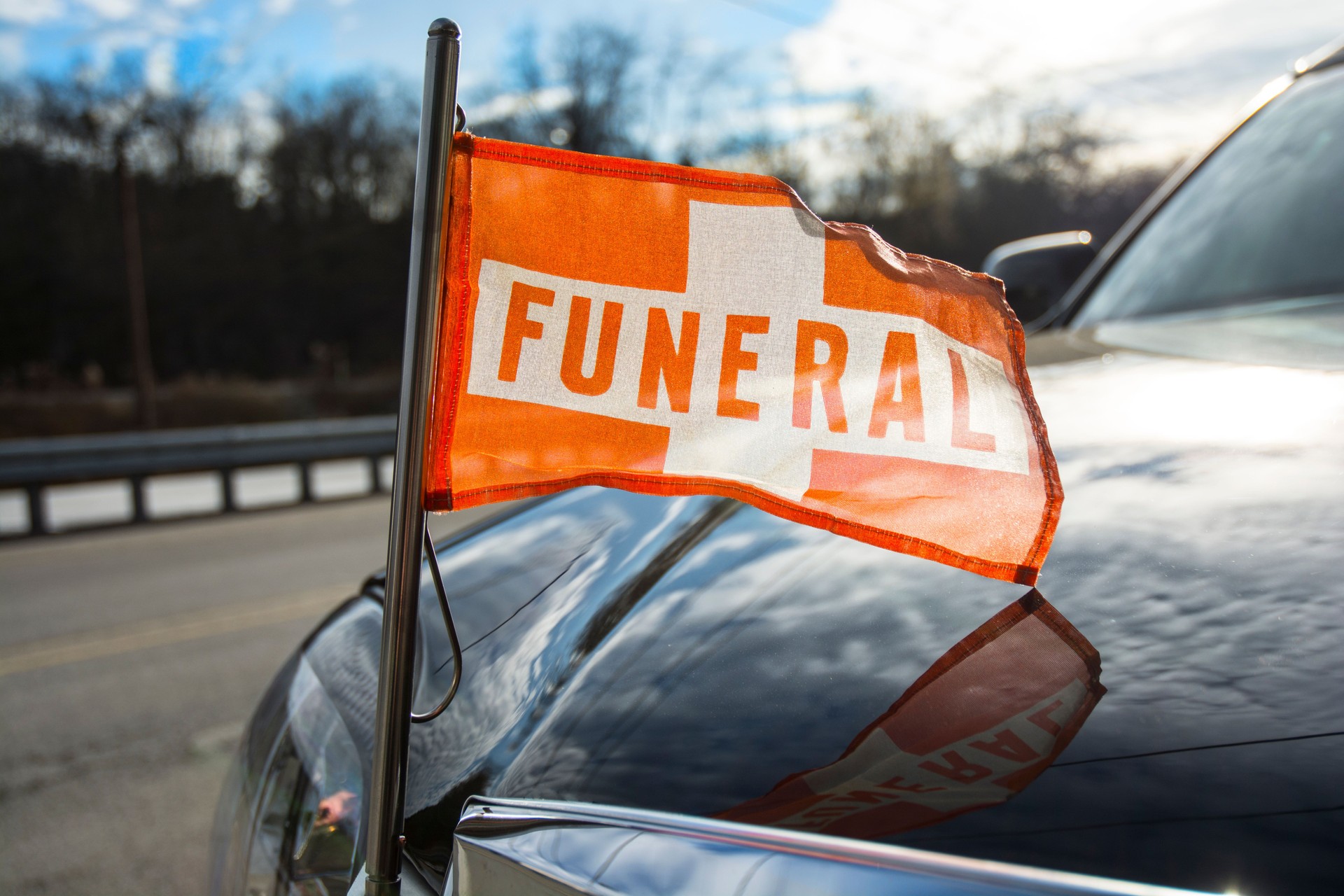 Funeral Car Orange Flag Death With Cloud Refletions